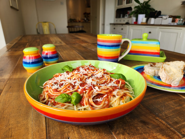 Pasta Dish with pasta, and other rainbow tableware