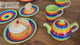 Tea for two, with small rainbow striped teapot and tableware